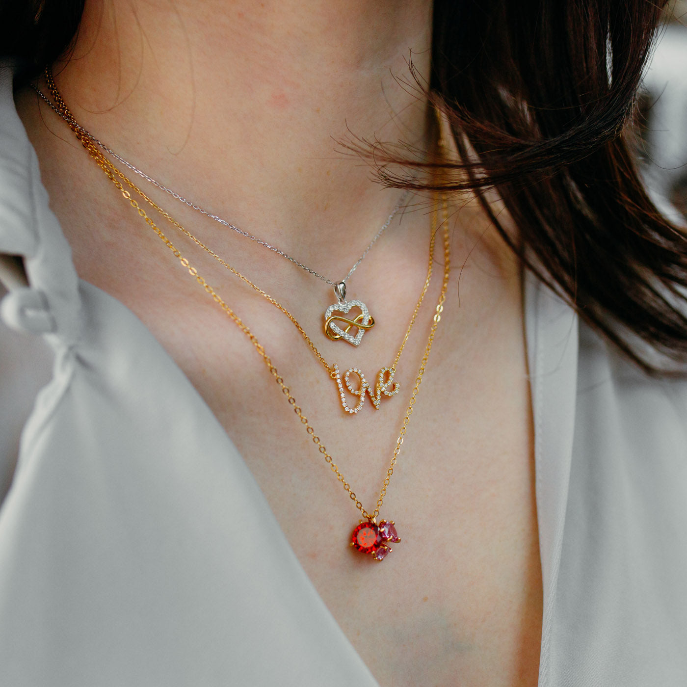 Julie Julsen Kette mit Anhänger HEART INFINITY bicolor mit 20 Zirkonia